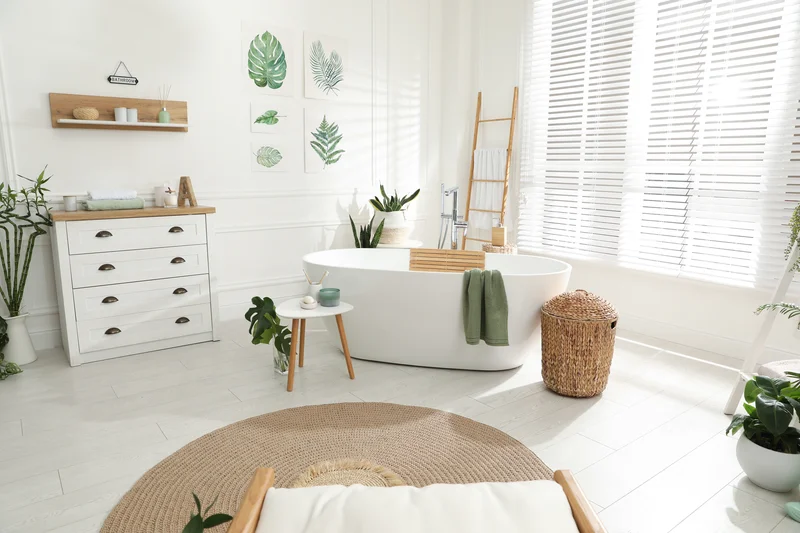 Boho chic bathroom remodel featuring a freestanding tub and house plants Boho chic bathroom remodel featuring a freestanding tub and house plants