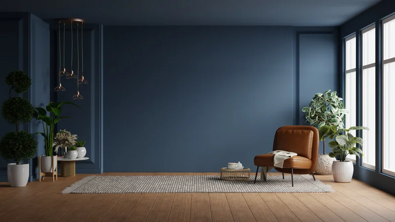 Interior painting service showcasing deep blue accent wall in living room.